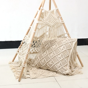 Detail showing Nordic macramé play tent set with matching pillow and floor mat