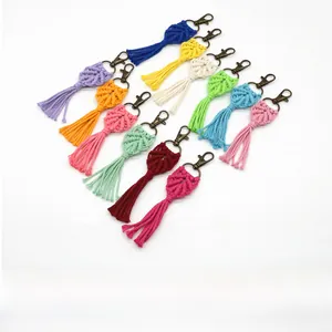 Macro view of handmade woven fringe keychains with vintage copper lobster clasps in 12 colors