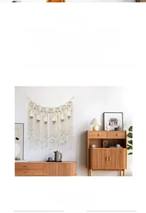 Close-up of bohemian macrame wall hanging with intricate woven patterns and fringe