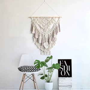Handmade macrame wall hanging with off-white cotton rope and purple tassel feather decor