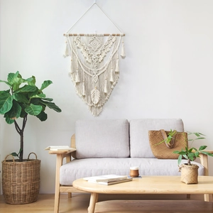 Handmade macrame wall hanging with cotton rope and wood rod for bohemian home decor