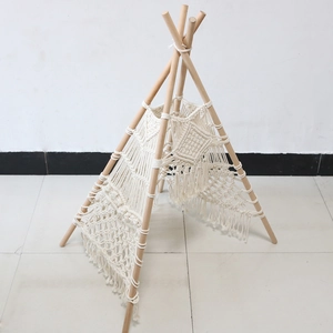 Detail of macrame weaving and tassels on a handcrafted Nordic cotton rope pet tent