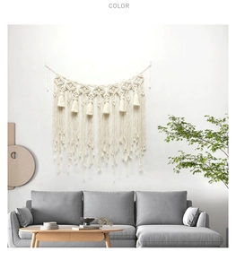 Detail of handcrafted macrame wall hanging with geometric weave and long fringe tassels