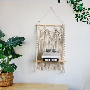 Handmade macrame wall hanging shelf with boho cotton rope and wooden storage board