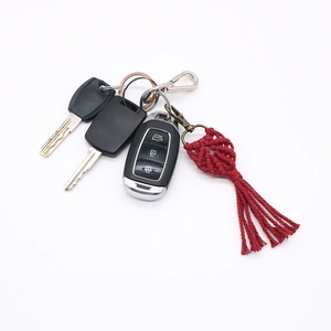 Handmade red woven heart keychain with long tassel and bronze ring for car keys