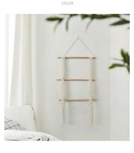 Detailed close-up of Bohemian woven cotton rope wall hanging with natural wooden dowels
