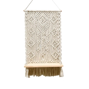 Handmade macrame wall hanging shelf with geometric patterns and natural wood plank