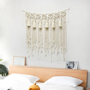 Bohemian handmade woven macrame wall hanging with geometric diamond pattern and long tassels