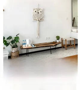 Detail of handmade owl macrame wall hanging with intricate woven patterns and tassels