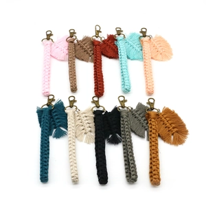 Detailed macro view of handmade macrame keychains in ten vibrant colors and leaf tassels