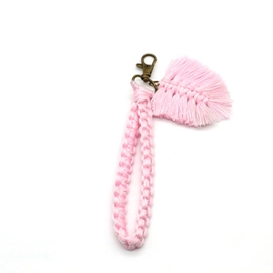 Detail of handmade light pink macrame cotton rope keychain with bronze lobster clasp