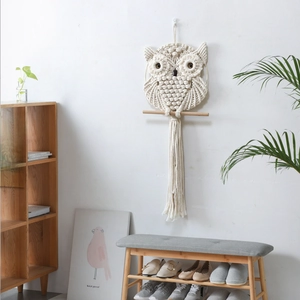 Handwoven owl macrame wall hanging in cream cotton rope with bohemian wooden rod