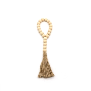 Guirlande de perles en bois style bohème avec pompon en jute naturel décoratif