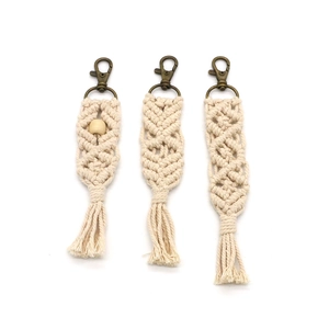 Set of three handmade cotton macrame keychains with wood beads and bronze metal clasps