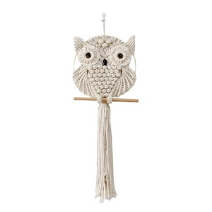 Handmade owl macrame wall hanging in boho style crafted with beige cotton rope and wood