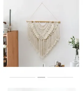 Detailed close-up of handmade Bohemian woven tapestry with cotton rope tassels on a wooden rod
