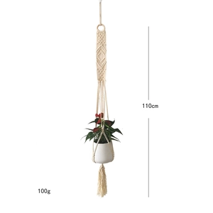 Detail of a 110cm handmade macrame plant hanger with cotton rope weaving and ring
