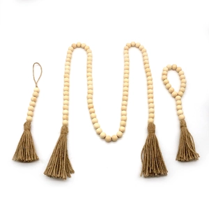 Lot de trois guirlandes de perles en bois naturel avec glands en jute pour décor bohème