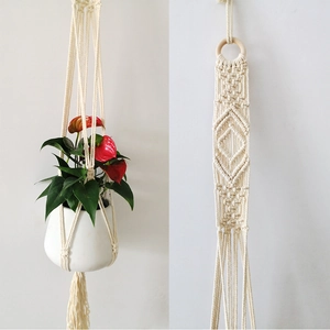 Bohemian handmade cotton plant hanger with woven geometric patterns and long tassels