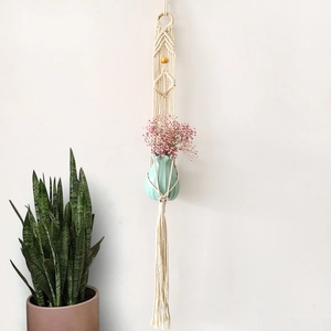 Bohemian macrame plant hanger with white cotton rope, wood ring and teal ceramic vase
