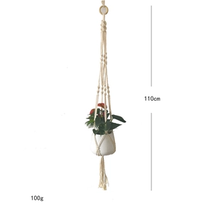 Detail of hand-woven cotton plant hanger with wooden ring, measuring 110cm and 100g weight