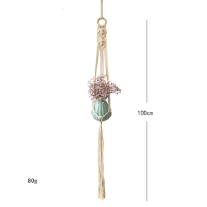 Detail view of 100cm handmade macrame plant hanger with cotton tassels and wooden ring