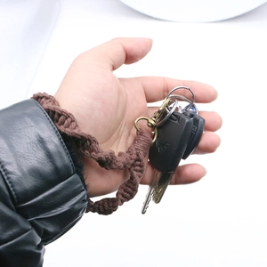 Brown braided cotton keychain showing the vintage gold hook holding multiple keys