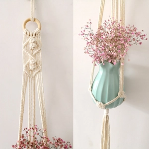 Detailed handmade cotton rope weave on a bohemian plant hanger with a wooden ring