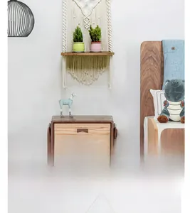 Detail of hand-woven bohemian wall shelf with natural cotton rope and wooden board