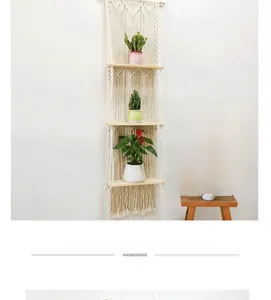 Detail of bohemian three-tier woven macrame wall shelf with natural wooden planks