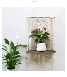 Detailed macro view of bohemian handmade cotton woven tapestry shelf with soft long tassels