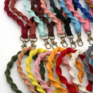 Detail of colorful woven cotton cord keychains with vintage bronze lobster clasps