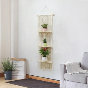 Three-tier macrame wall hanging shelf with handmade cotton rope and wooden boards