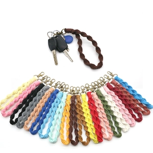 Handmade bohemian braided cotton cord keychain wristlets in various colors with metal clips