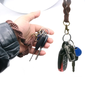 Handmade dark brown bohemian woven cotton rope keychain with vintage bronze spring clasp
