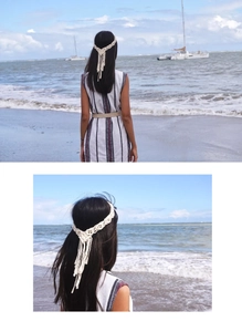 Detail van handgemaakte boho macramé hoofdband met katoenen franjes voor op vakantie