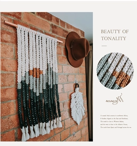 Detail of bohemian handmade woven tapestry showing intricate cotton rope texture and patterns