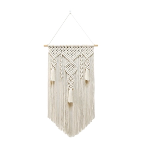 Handmade Macrame wall hanging with geometric knots and tassels in Nordic bohemian style