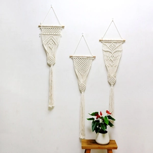 Set of three boho macrame wall hangings with handmade cotton rope tassels and wood poles