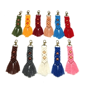Handmade bohemian macrame tassel keychains with wooden beads in eleven vibrant colors