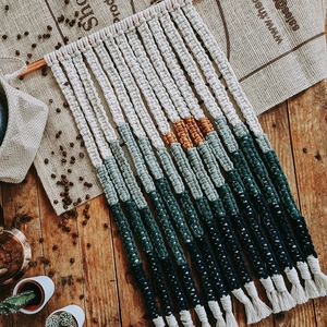 Handwoven bohemian wall tapestry with color gradient and fringe decor for home