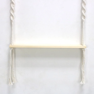 Detailed macro view of spiral macrame knotting and light natural wood board