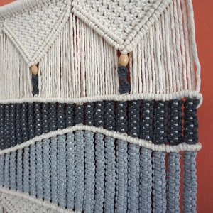 Handmade macrame wall hanging with geometric weave and wood beads in Nordic style