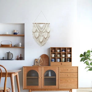 Minimalist macrame wall hanging with handmade leaf design and wood rod decor