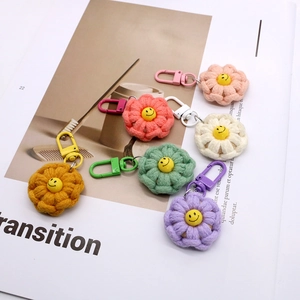 Handmade woven cotton flower keychains with smiley face charms and lobster clasps