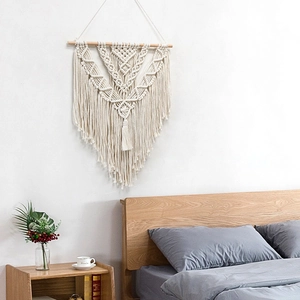 Nordic macrame wall hanging with boho cotton fringe and geometric handwoven patterns