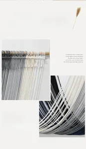 Detail shot of grey and black handmade macrame tapestry with natural cotton weave textures