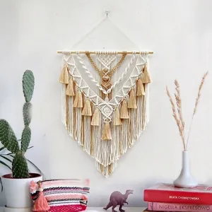Bohemian woven macrame wall hanging with cotton tassels on a wooden rod for home decor