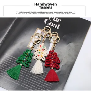 Detail of handcrafted woven Christmas tree pendants with colorful beads and long tassels