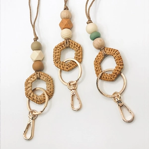 Handmade silicone bead lanyards with woven rattan rings and metallic keychains in three colors